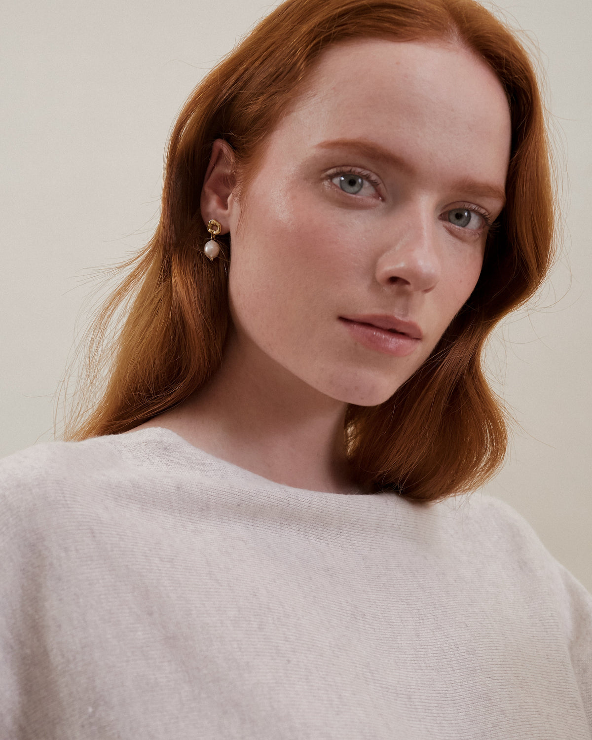 Model wearing Maudella pearl drop earrings